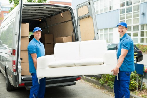 Man and van service loading furniture in a Hampstead street