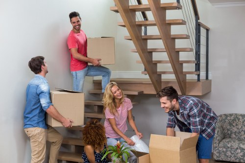 Moving team carefully loading boxes into a van