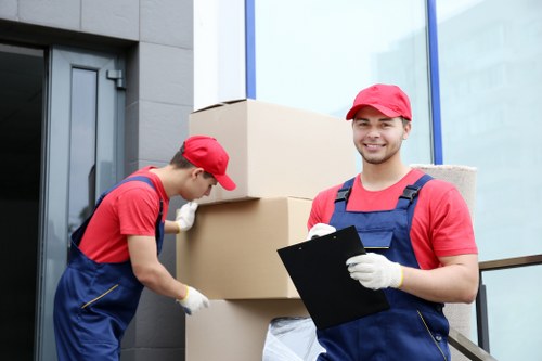 Removal team preparing a move in Hampstead with boxes and furniture