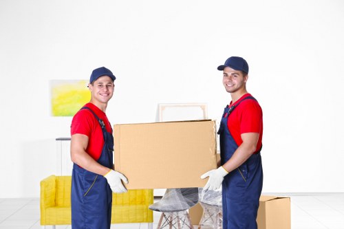 Moving house logistics in Hampstead with packed boxes and removal van