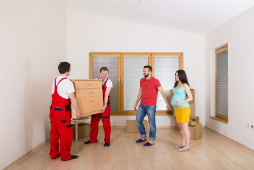 Local removals team handling a move from a Hampstead flat with care