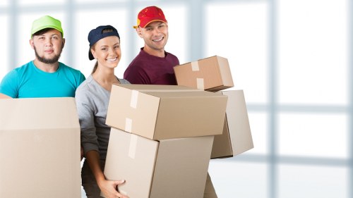 Team assessing risks before lifting heavy furniture