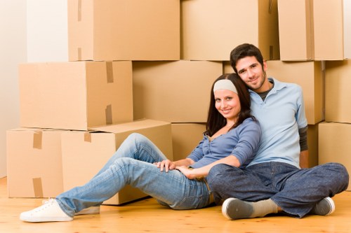 Professional movers handling furniture on a Hampstead street
