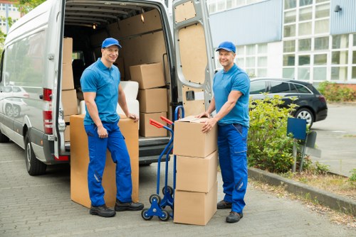 Office furniture and equipment being moved during a Hampstead business relocation