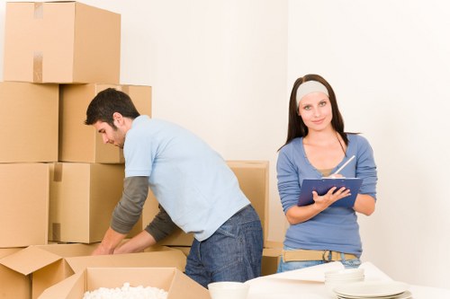 Packed boxes and furniture loaded into a Hampstead removal van